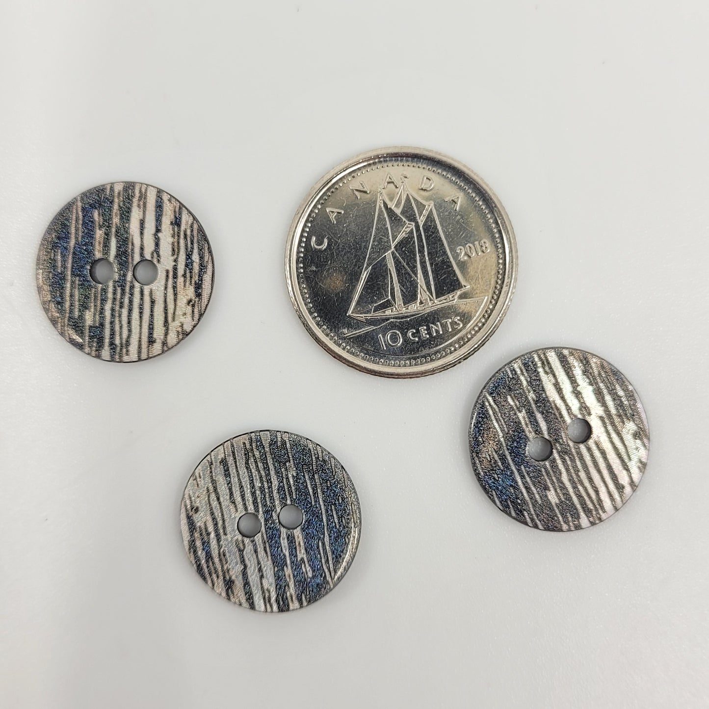 Buttons ~ "Fancy mother-of-pearl"