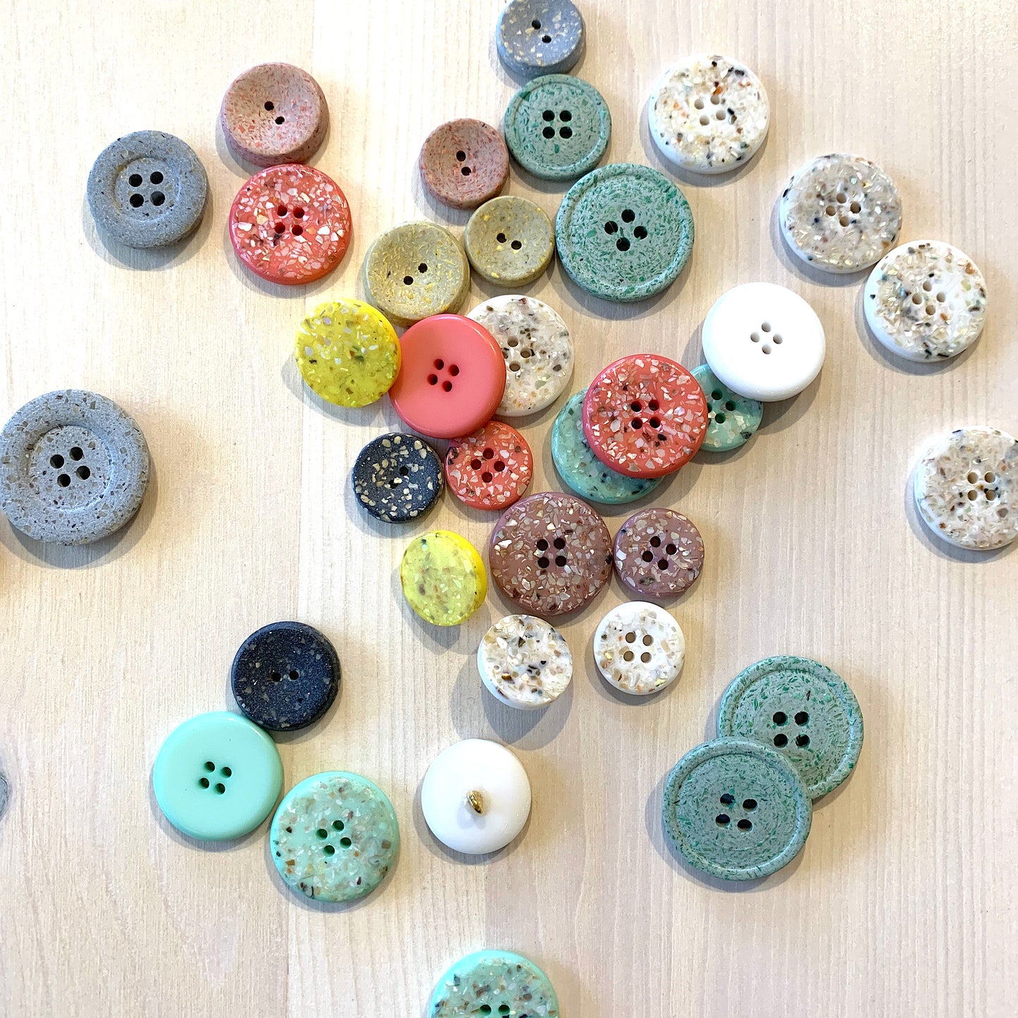 Recycled polyester buttons